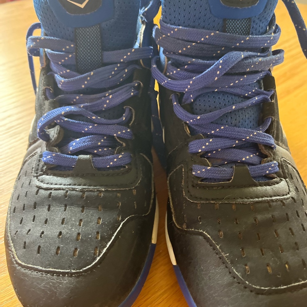 Under Armor boys size 4 1/2 baseball cleats black and blue mild wear